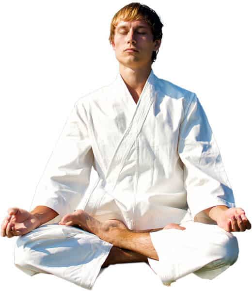 Martial Arts Lessons for Adults in Norwood NJ - Young Man Thinking and Meditating in White